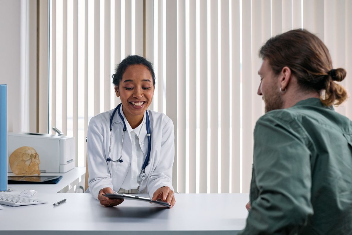 Physician consulting with a patient about medically supervised weight loss before surgery