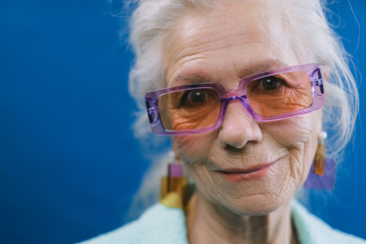 Confident smiling senior woman — considering whether HRT is safe after 60